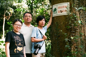Three nature educators from the Xishanugbanna Tropical Botanic Garden, Yunnan, pictured at a habitat restoration project which involves students from a local village. One of the educators is profiled in the exhibition. Courtesy Crossed Pollinations, all rights reserved